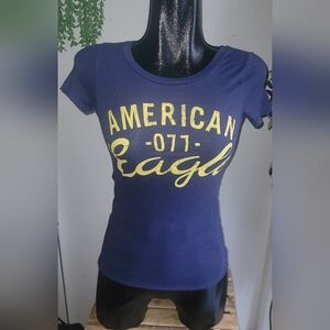 American eagle T-shirt size xs in navy blue with yellow lettering.